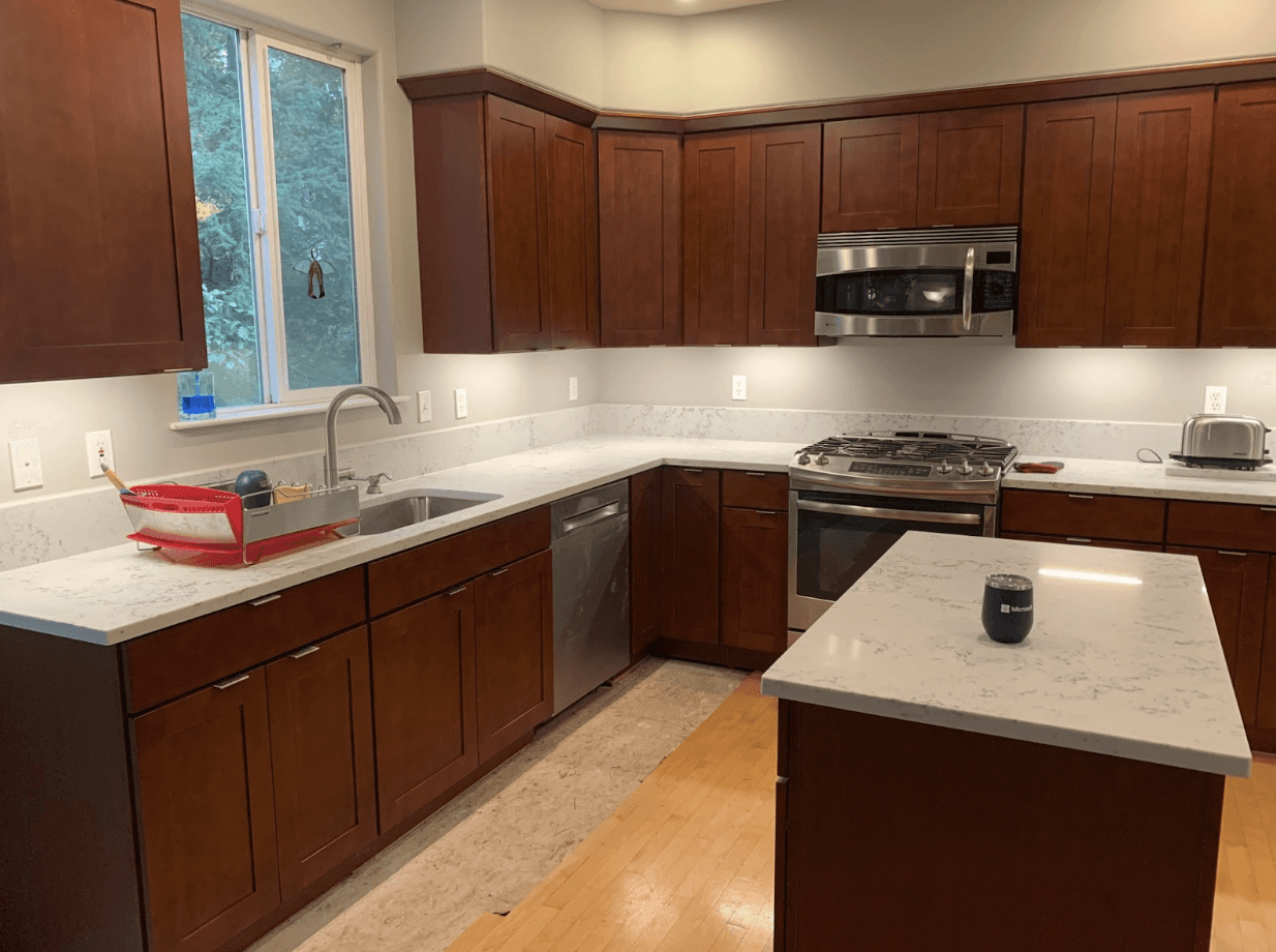 Remodeled kitchen with cherry cabinets, quartz countertops and stainless appliances in Bothell, WA